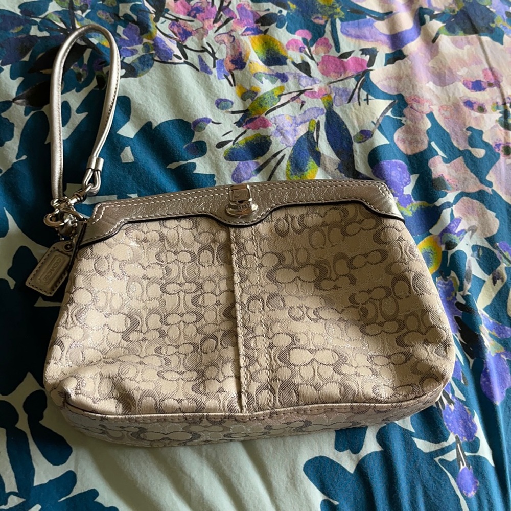 Like new- CoachSilver wristlet clutch